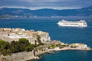 Calm Prints: High angle view of a town with cruise ship in the background