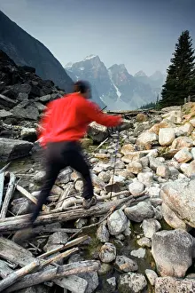 50 54 Years Prints: Hiker on Moraine Creek with Wenkchemna mountain range background