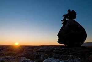 Imitation Prints: Hiker sitting on head-shaped boulder