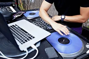 Joining Prints: Hispanic dj playing music in backyard