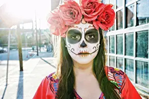 Chic Prints: Hispanic woman on sidewalk wearing skull face paint