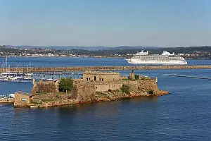 South Europe Prints: Historic fortress Castle San Anton at the harbour entrance and cruise ship Seven Seas Splendor leaving port