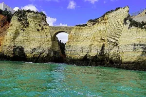 Beaches Prints: Historic Roman stone bridge at Praia da Batata beach in the rocky coast of Lagos