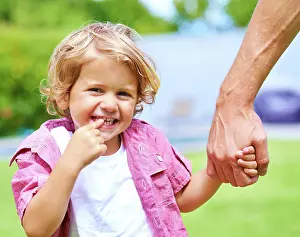 Guardian Prints: Holding hands, single parent or child in park for portrait