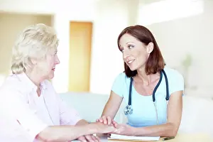 Consult Prints: Holding hands, support and doctor with old woman in hospital for consulting