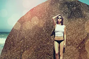 Bokeh Prints: Holiday, confident and woman with sunglasses by rock