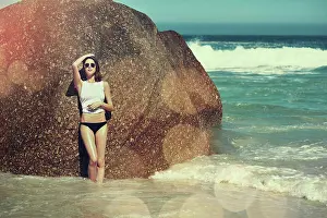 Bokeh Prints: Holiday, woman and sunglasses by beach rock