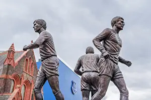 Soccer Prints: The Holy Trinity statue by Goodison Park in Liverpool featuring Everton Football Club legends Howard Kendall with Alan