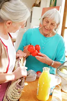Converse Prints: Home care attendant helping 80 years old elderly woman with shopping
