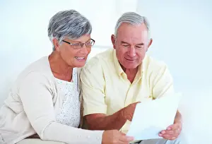 Decision Prints: Home, senior couple and budget with document for finance