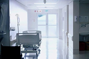 Passageway Prints: Empty hospital bed with intravenous drip in hospital ward