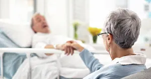 Disabled Prints: Hospital, bed and senior couple holding hands