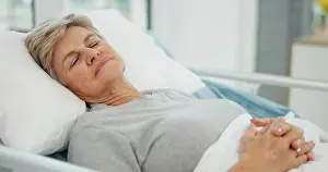 Dreaming Prints: Hospital, sleep and senior woman in bed for recovery