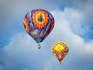 Hot Air Balloon Prints: Two hot air balloons side by side against clouds and sky