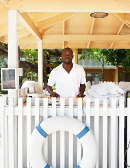 West Indies Prints: Hotel employee standing in a hotel, Jamaica