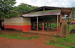 Jose Prints: house near river on stilts with flood mark clearly visable San Jose del Guaviare