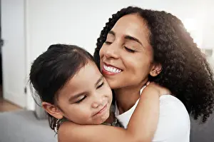 Lounge Prints: Hug, love and girl with mother on a sofa