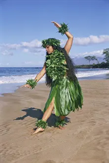 Afternoon Prints: Hula dancer in ti-leaf skirt in a dancing pose on the beach
