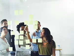 Conversation Prints: Idea, brainstorming and business people in office for meeting