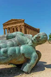 Sicily Prints: Ikaro caduto (fallen Icarus) bronze sculpture by Polish artist Igor Mitoraj in front of the Temple of Concordia (Greek)