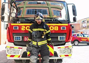 Gear Prints: image of firefighter next to the water truck