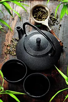 Beverage Prints: Image of traditional eastern teapot and teacups on wooden desk