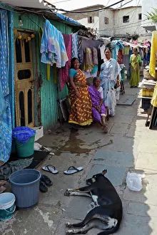 House Prints: India, Maharashtra, Mumbai, Women standing outside their homes in a lane in a slum in Colaba