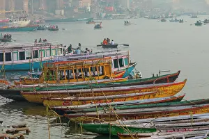 Uttar Pradesh Prints: India, Uttar Pradesh, Varanasi. Boats moored along the banks of the Ganges River