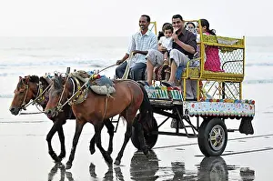 Exterior Photograph Prints: Indian family on a horse cart on the beach at Juhu