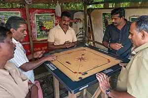 India Prints: Indian man playing carrom board game, Munnar, Kerala, India, Asia