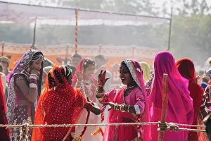 January Prints: Indian woman dancing in brightly colored clothing at Jaisalmer Desert Festival