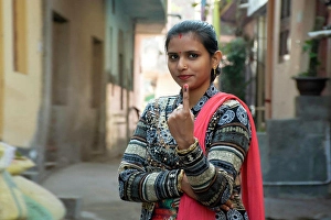 Decision Prints: indian woman showing voting mark in hand after polling the Vote