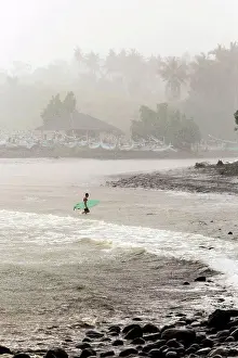 30 To 40 Years Old Prints: Indonesia, Bali, surfer carrying surfboards in the sea