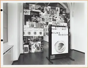 Input of the exhibition formed by a wall of posters