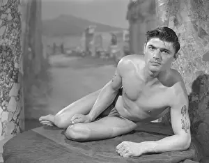 Bodybuilder Prints: Inviting Muscular Tattooed Nude Male c.1954