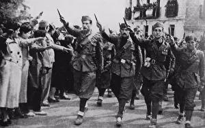 Soldiers Prints: Italian Fascist soldiers march into a town in Spain during the Spanish Civil War