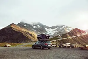 Tent Prints: Italy, Austria, Car with tent on roof in mountain landscape