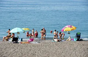Umbrellas Prints: Italy, Campania, Amalfi Coast, Minori beach crowded with families