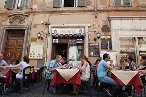 Cafe Prints: Italy, Lazio, Rome, Diners eating al fresco at a restaurant in a back street