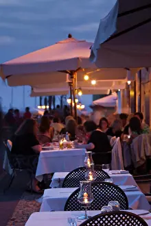 Cafe Prints: Italy, Sardinia, Alghero. Cafe crowds on Bastioni San Marco, dusk