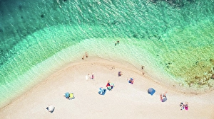 Parasol Prints: ITHACA ISLAND, GREECE - 7 August 2017 : Aerial photography of people on the beach of Agios Loannis