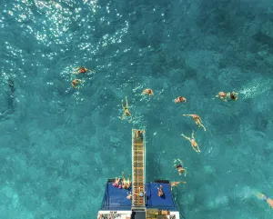Ferry Prints: ITHAKI - GREECE, AUGUST 9 2018: Aerial view of people on ferry and swimming in sea