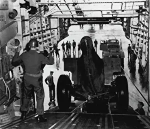 Aeronautics Prints: It's Spacious -- Giant Globemaster C-124 is loading 155 mm howitzer