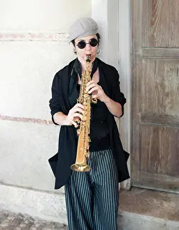 Instrument Prints: Jazz music dressed in retro style playing saxophone in the street