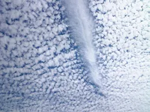 Heavens Prints: Jetstream dissipating path through fluffy clouds