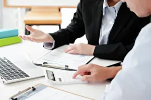 Ambition Prints: Job Interview Process with Potential Candidate A candidate engaged in a job interview with a hiring manager