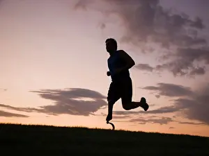 Disability Prints: jogger with a right below knee prosthetic running leg