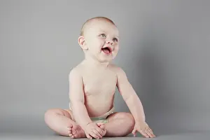 Playful Prints: Joyful baby sitting and laughing