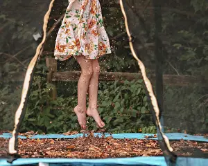 Jump Prints: Jumping in the fall leaves on her trampoline
