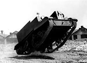 Mid Air Prints: Jumping To It -- A mechanisod machine gun carrier jumps in the air when hitting a jump on a testing ground